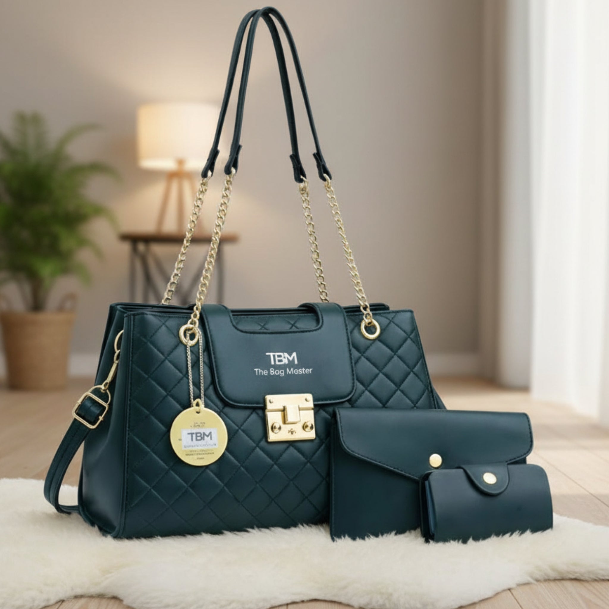 Green handbag with gold accents and matching wallet on a white surface.