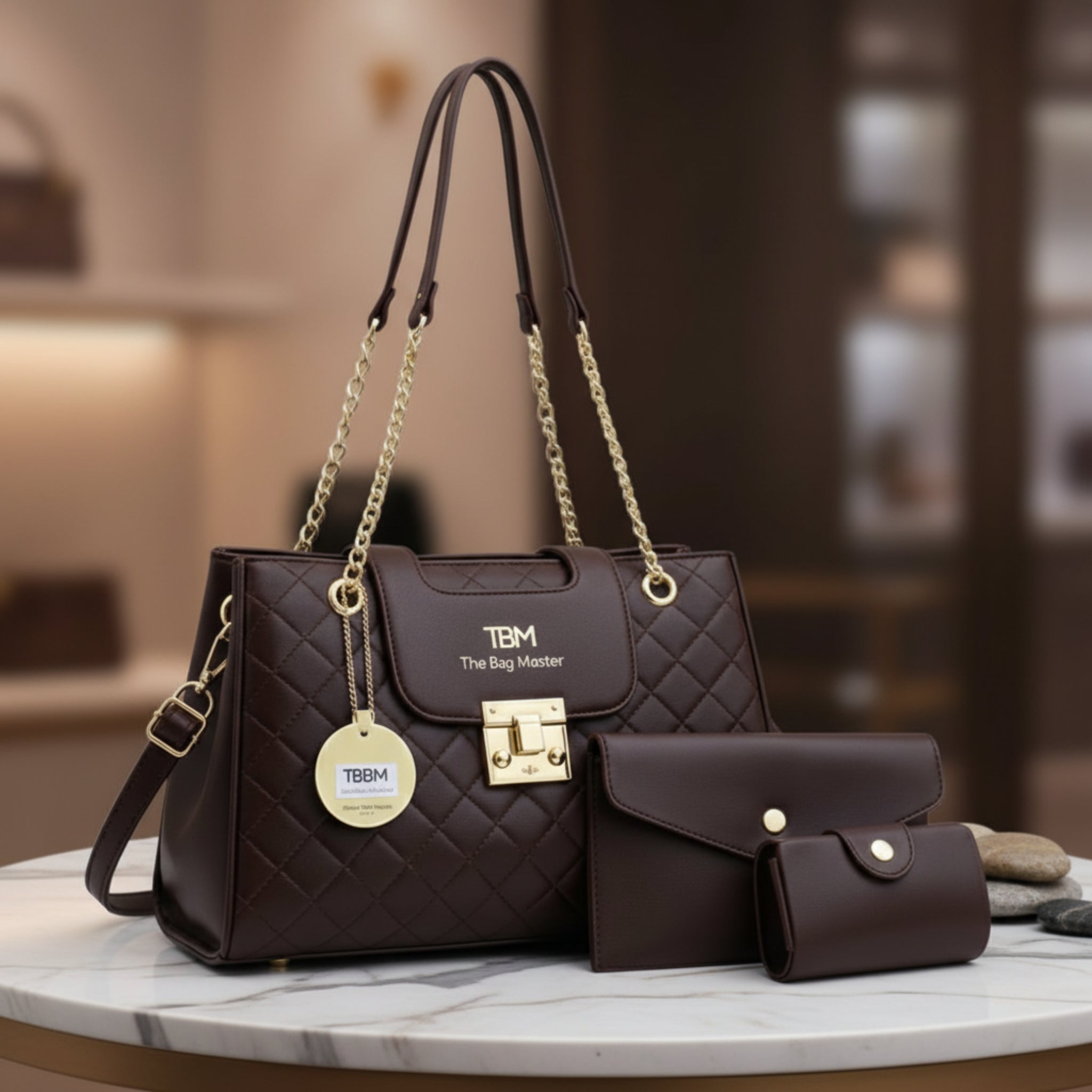 Brown quilted handbag with matching wallet on a marble surface, blurred background