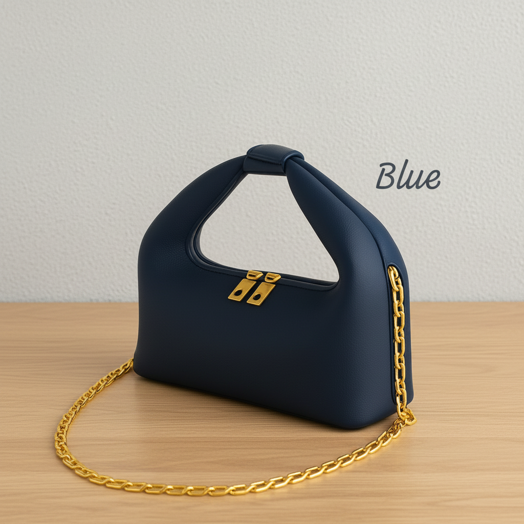 Blue handbag with gold chain on a wooden surface and light gray background