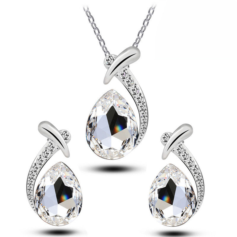 Jewelry set with teardrop-shaped crystals on a white background